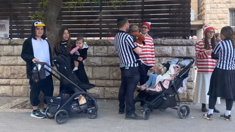 In Bunkers And On Streets, Israelis Celebrate Purim Amid Repeated Missile Strikes