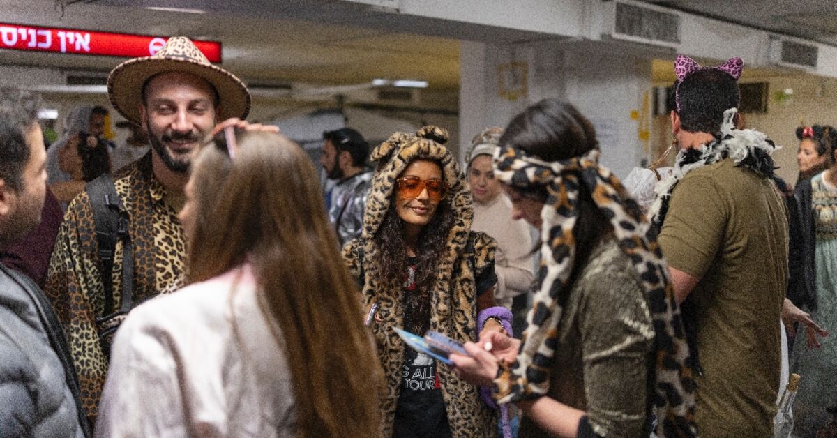 Underground party scene: Israelis celebrate Purim in air raid shelters