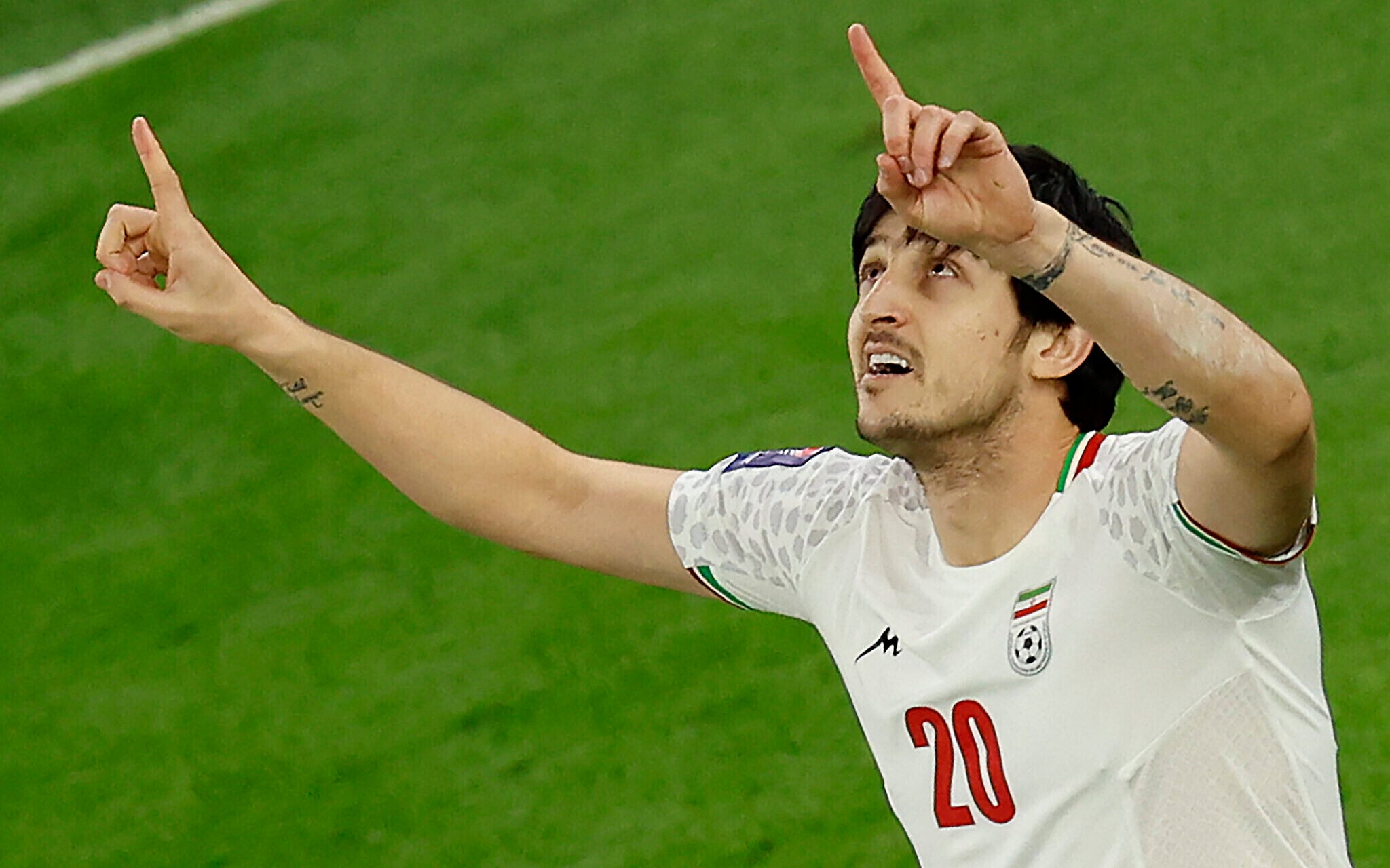 Iran threatens to seize assets of soccer star Sardar Azmoun over photo with UAE leaders