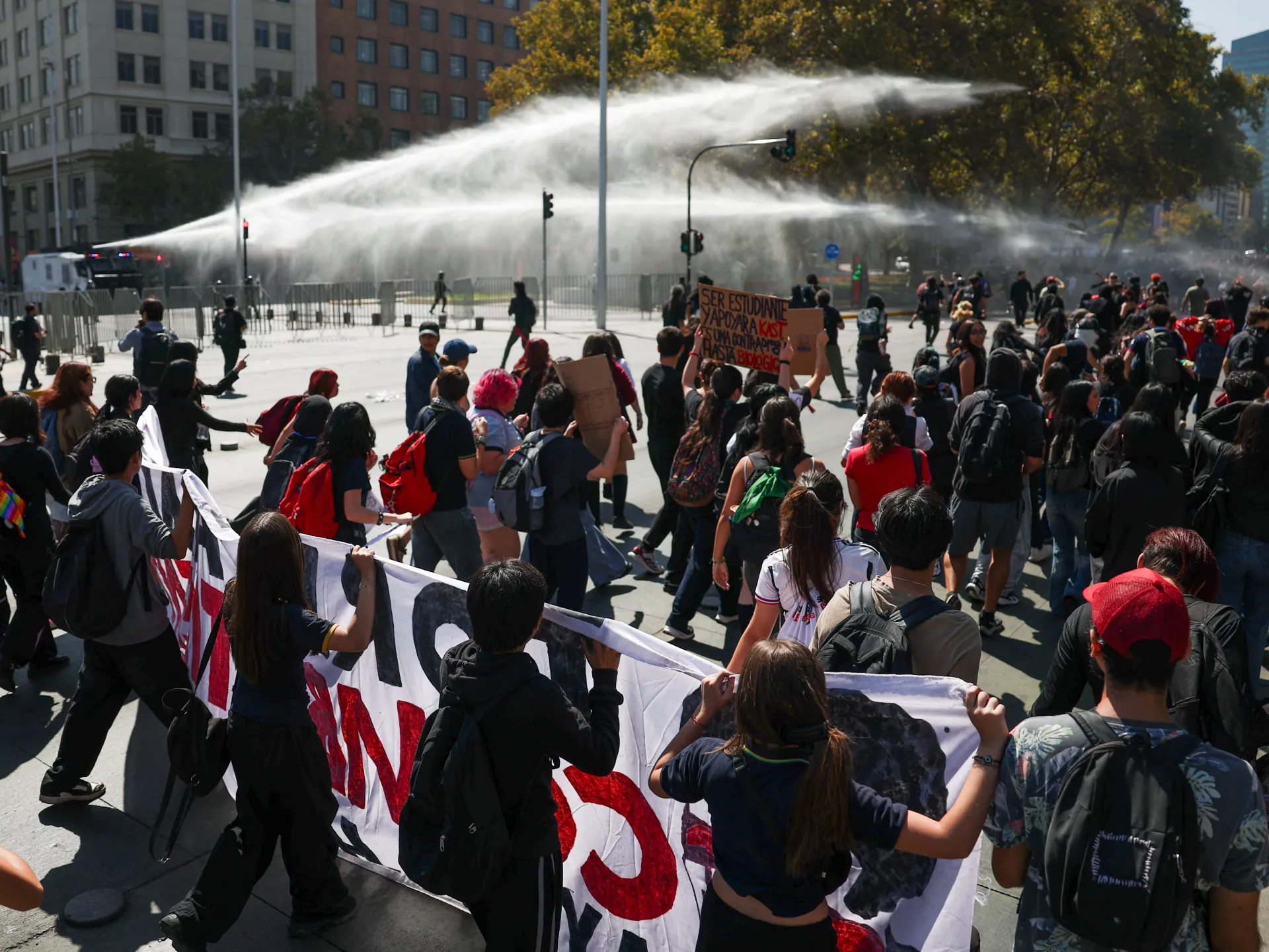 Police fire water cannons at Chile student protest | Protests