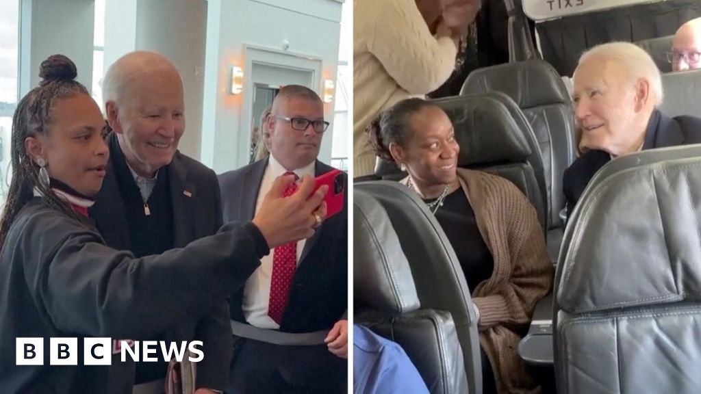 Biden takes selfies with passengers as he takes commercial flight