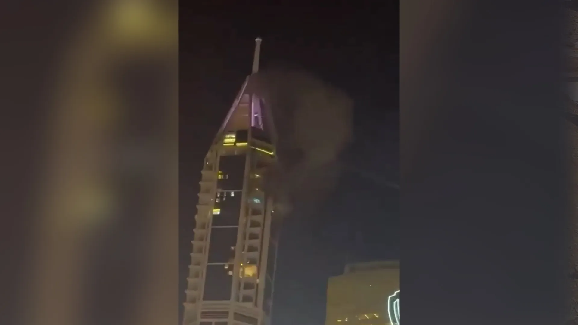 Smoke rises from a Dubai tower after attack | Conflict