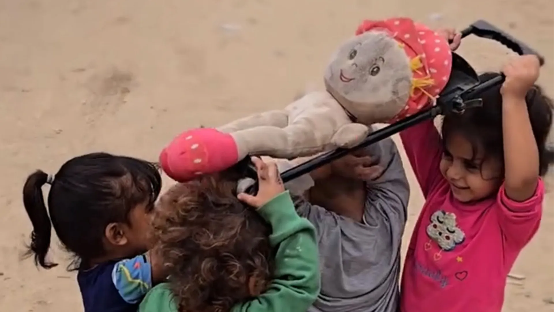 Children in Gaza reenact a funeral procession during play | Gaza