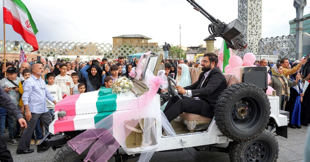 Iran stages mass weddings for couples ready for war ‘sacrifice’