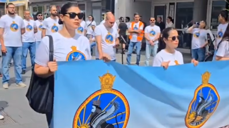 Symbols Of The Shah’s Secret Police Seen At Iranian Royalists Rallies Abroad