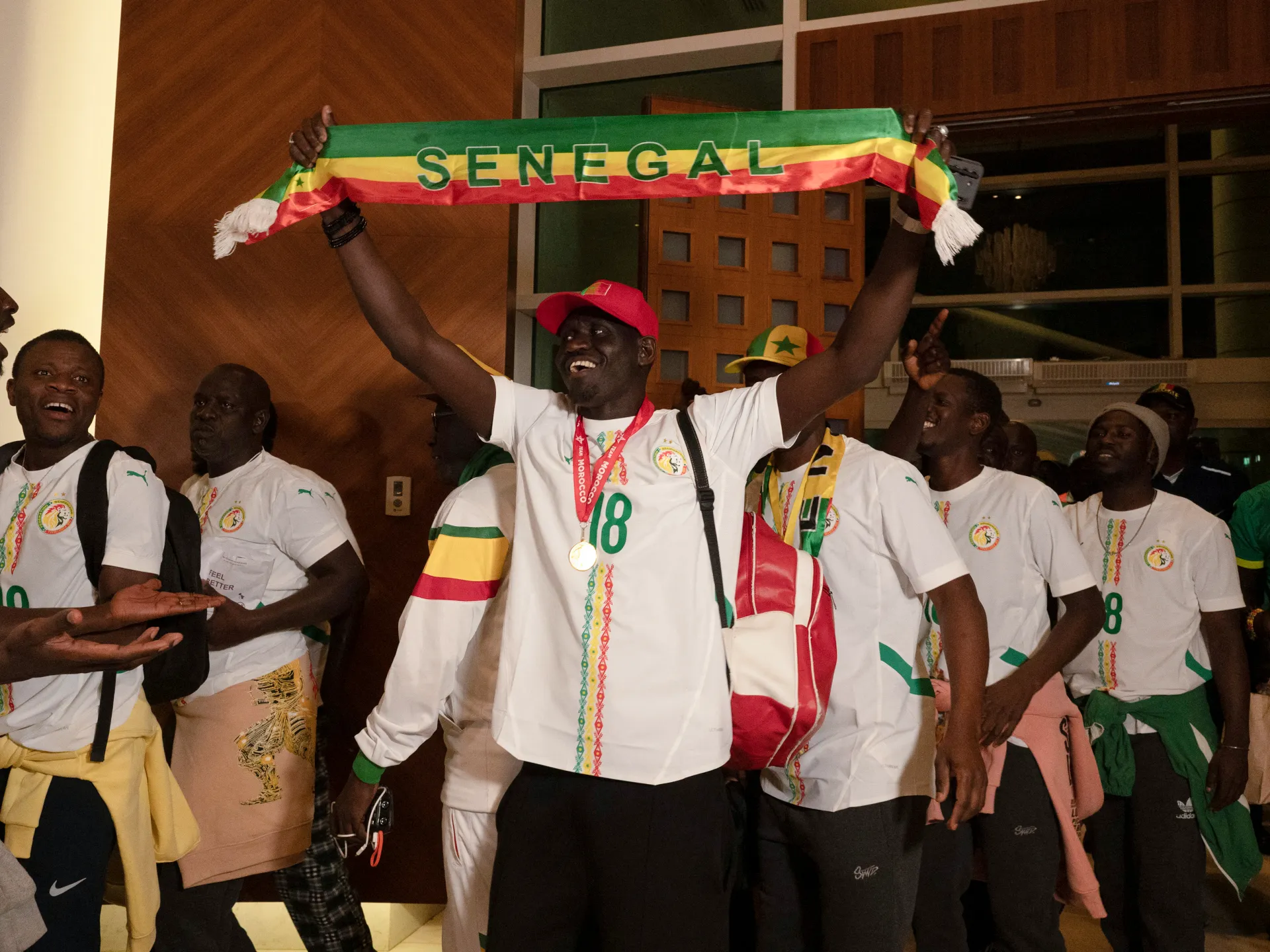Senegal football fans return home after royal pardon in Morocco | Football News