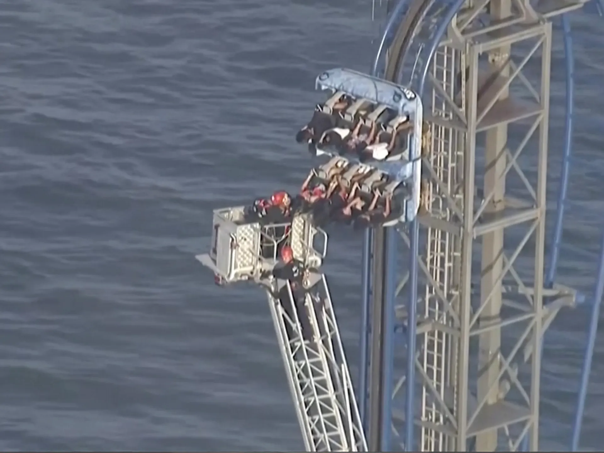 Firefighters work to free riders stuck atop a rollercoaster in Texas | News