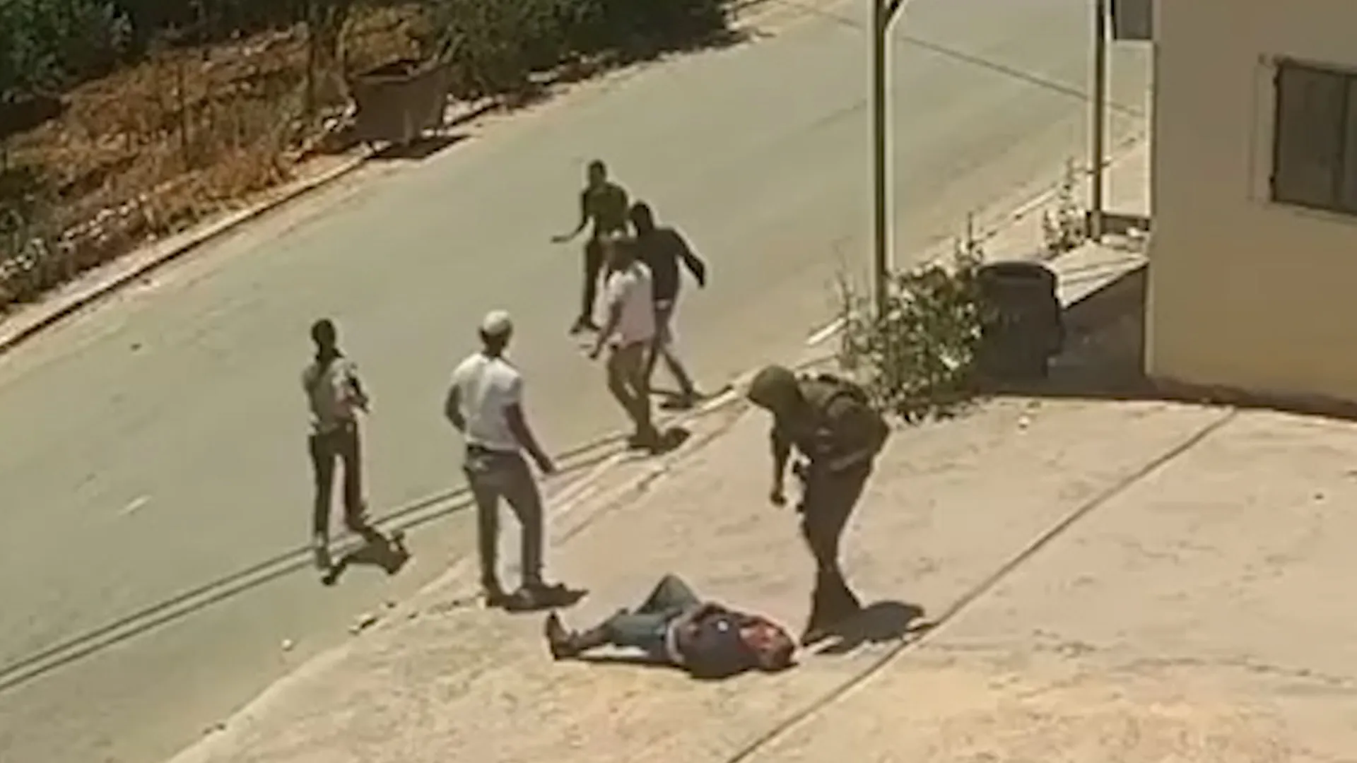 Video shows Israeli soldier and settlers assaulting two Palestinians | Occupied West Bank